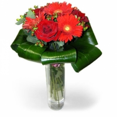 A eurobouquet of red roses and gerbera daisies with green fillers