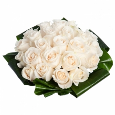 A round tight bouquet of cream roses with green fillers