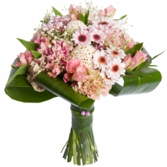 A bouquet of pink carnations, parrot flowers and spray chrysanthemums adorned by green fillers