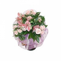 A tender bouquet of pink spray roses and parrot flowers with green fillers