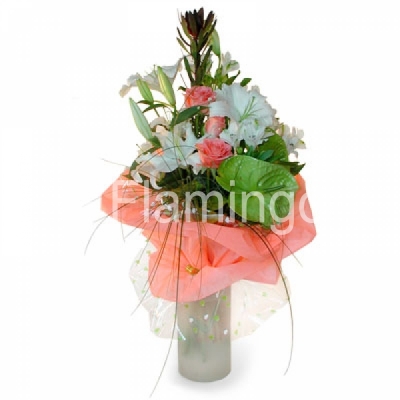 A nicely wrapped bouquet of lilies and roses with green fillers