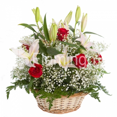 A basket with red roses, white lilies and green fillers