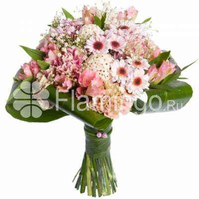 A bouquet of pink carnations, parrot flowers and spray chrysanthemums adorned by green fillers