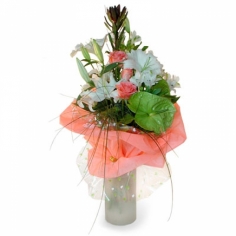 A nicely wrapped bouquet of lilies and roses with green fillers