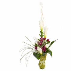 A tall bouquet of white calla lilies and crimson parrot flowers