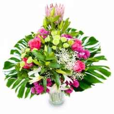 A composition of white lilies, pink chrysanthemums and roses with green fillers