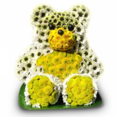 A flower composition in the shape of a bear