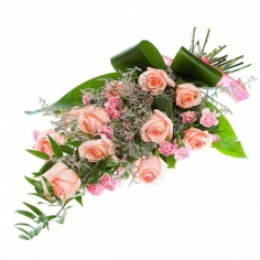 A bouquet of pink roses and carnations ornamented by green fillers