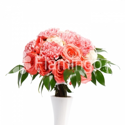 Pink and white roses and pink carnations in a round bouquet with green fillers