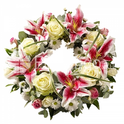 A funeral wreath with roses, lilies and chrysanthemums