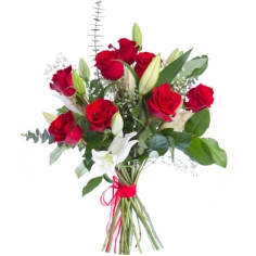A bouquet of red roses with white lilies and green fillers