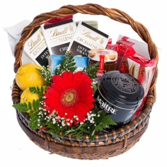 A basket with sweets, cheese and tea