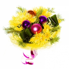 Bright yellow chrysanthemums arranged with greenery and NY ornaments