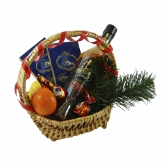 A basket with cognac, chocolate, tangerines and a lemon