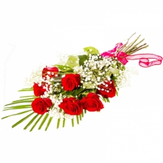 A bouquet of seven red roses with green fillers