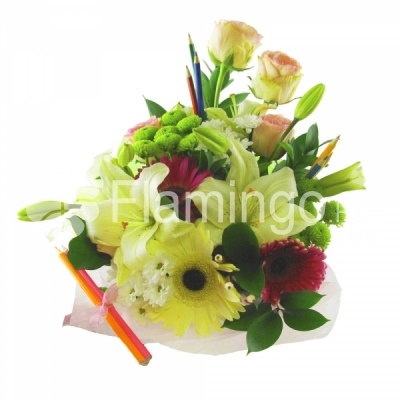 A composition of lilie, gerbera daisies, roses and chrysanthemums adorned by green fillers