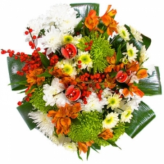 A round bouquet of chrysanthemums and parrot flowers with green fillers and decorative berries
