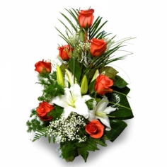 A bouquet of orange roses and white lilies with green fillers
