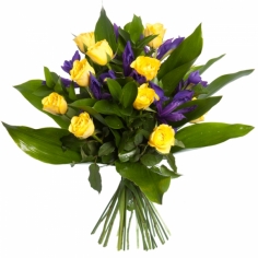 A bouquet of yellow roses and blue irises with green fillers