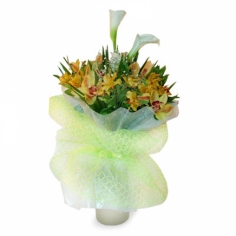A nicely wrapped bouquet of white calla lilies, yellow parrot flowers and green orchids