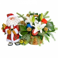 A basket of lilies, pine branches, green fillers and toy Santa