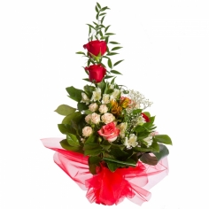 A nicely wrapped bouquet of roses and parrot flowers