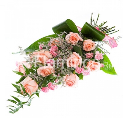 A bouquet of pink roses and carnations ornamented by green fillers