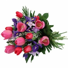 A bouquet of tulips and irises with green fillers