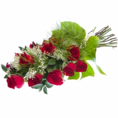 A bouquet of red roses, baby breath and green fillers