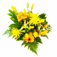 A bouquet of yellow chrysanthemums, gerbera daisies, calla lilies, tulips and lilies with green fillers