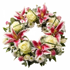 A funeral wreath with roses, lilies and chrysanthemums