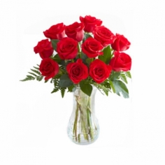 Red roses of exclusive quality in a glass vase