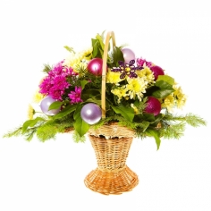 A basket with flowers, pine branches and New Year ornaments