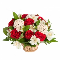 Red roses and white parrot flowers arranged in a basket with green fillers