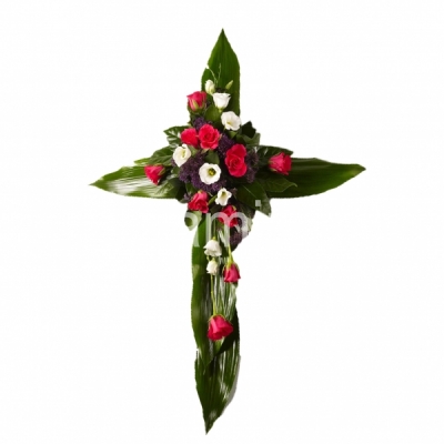 A cross-shaped funeral composition with roses and green fillers